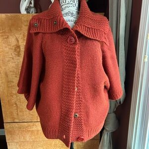 Women's Burnt Orange Button-Up Sweater with two pockets